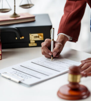 Business man hands close up working with contract lawyers specialize in dealing with legal issues