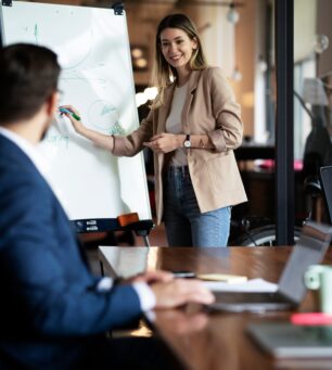 Businesswoman,Present,Her,Idea,To,Working,Team.,Young,Beautiful,Woman